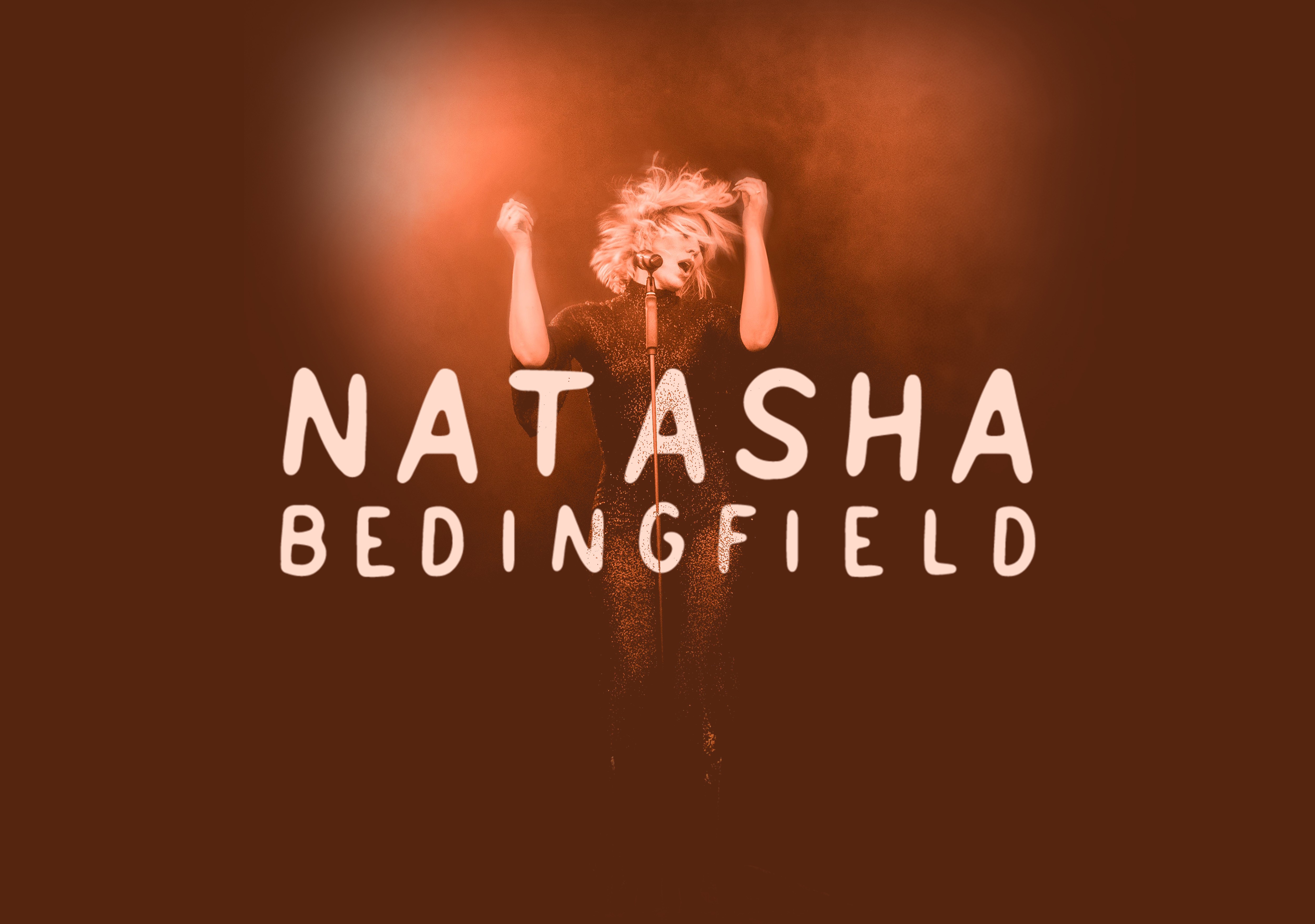 Person with curly hair raising arms, text reads 'NATASHA BEDINGFIELD', warm background, 16 words, confidence 0.9