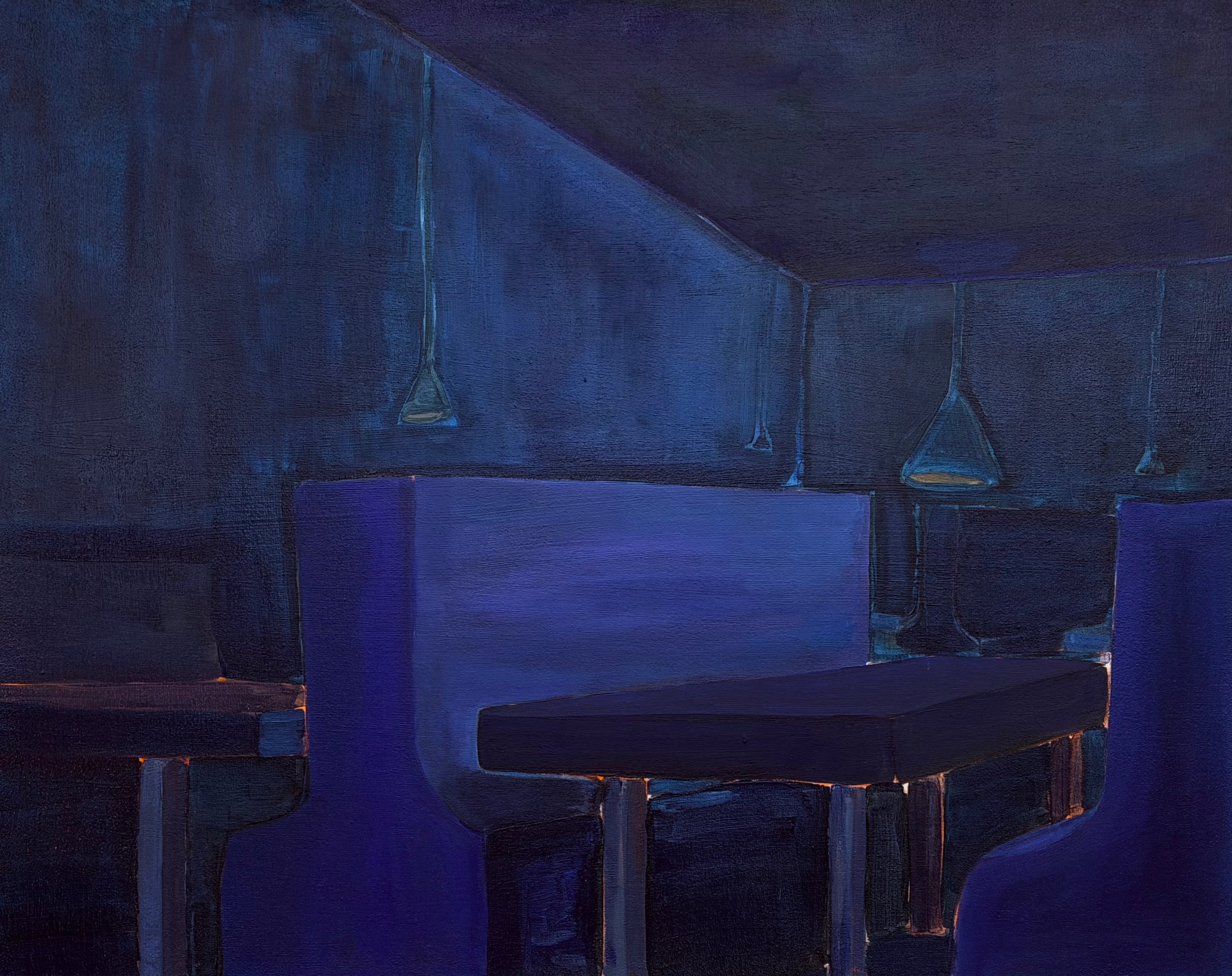 Dark blue interior with hanging pendant lights and seating, dimly lit atmosphere.