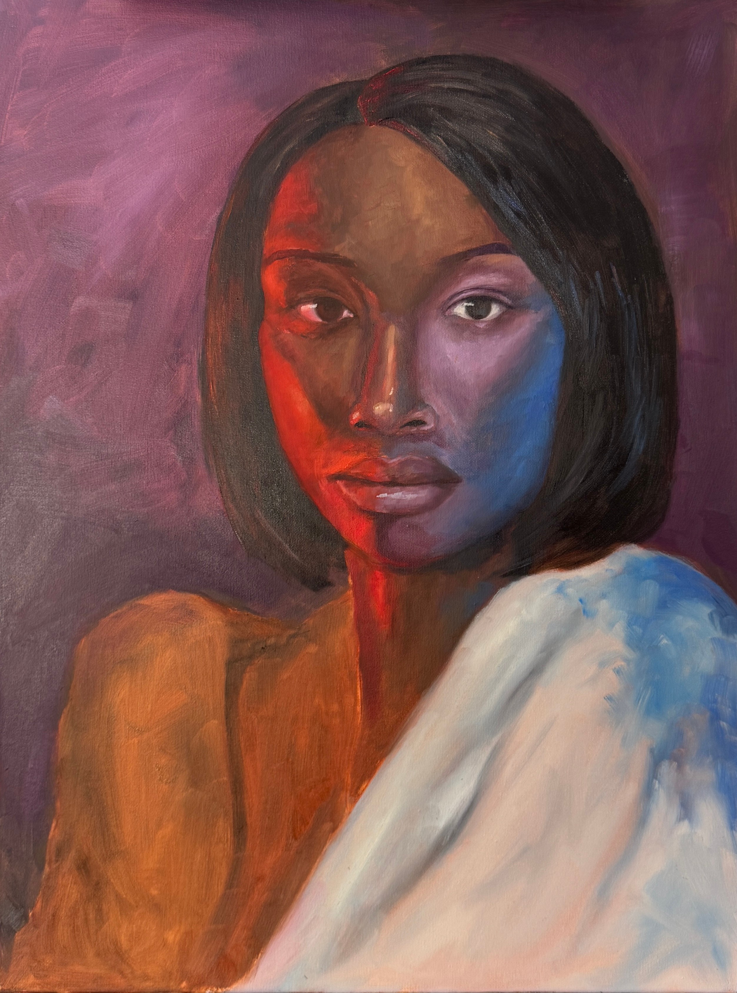 Portrait of a woman with short black hair, looking at the viewer, with a colorful background and a white cloth over her shoulder.