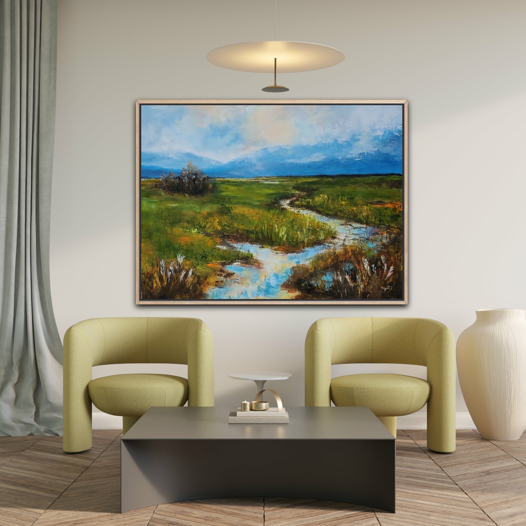 Living room with two yellow armchairs, a black coffee table, a large landscape painting, and a white vase, with a ceiling light.