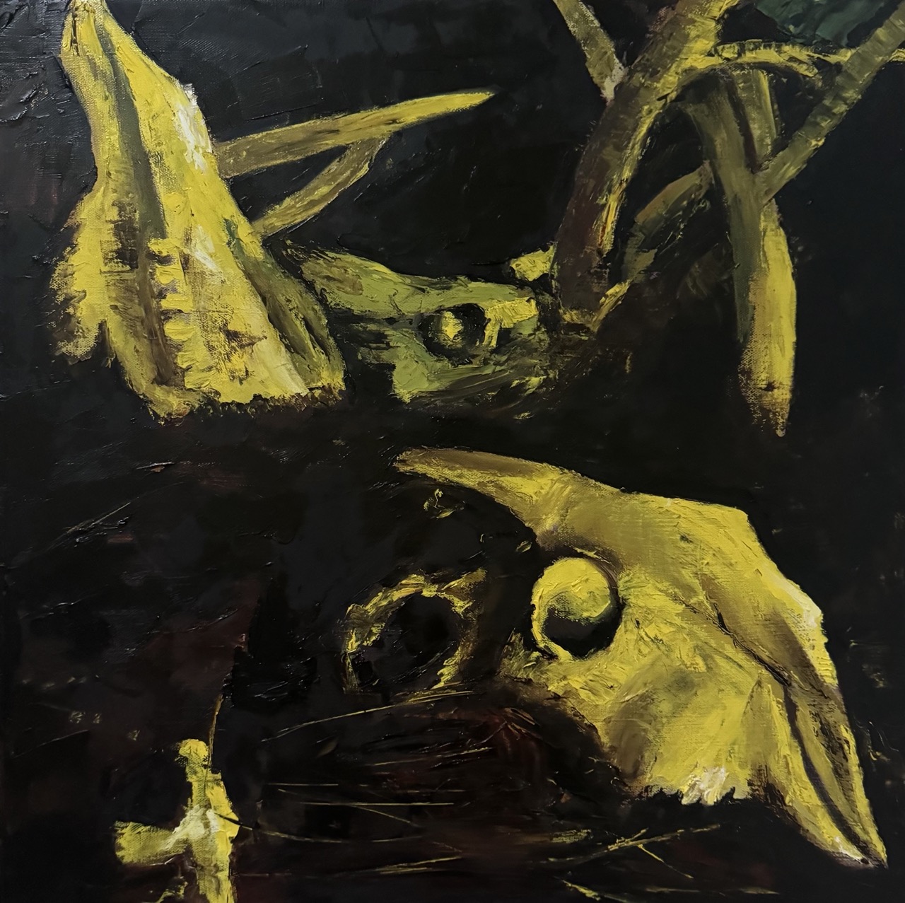 Abstract painting with yellow and black colors, featuring shapes resembling a face and organic forms.