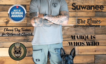 Man in gray shirt and cap with a black dog in front, wooden background with training-related text and logos.