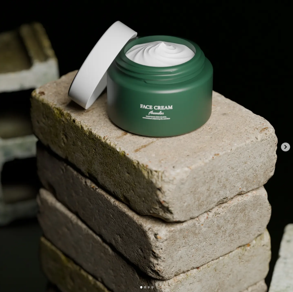 Open green jar of face cream on stacked bricks, black background, cream visible inside jar.