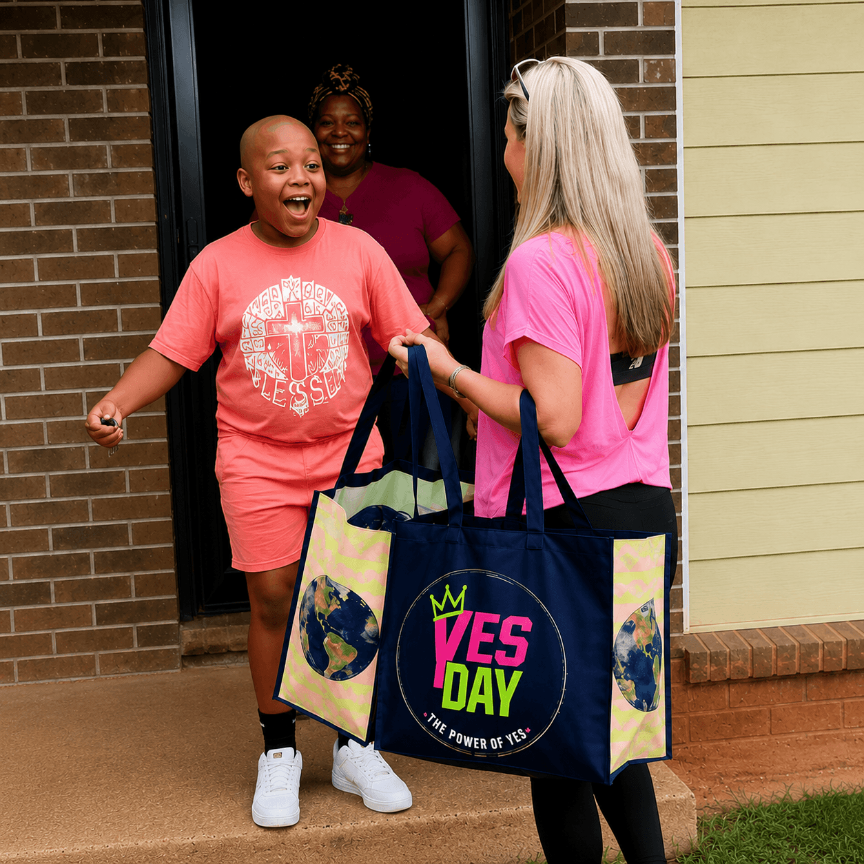Three women standing outside a house, smiling and talking, with one holding a large bag. One woman is wearing a pink shirt, another in a purple shirt, and the third in a pink shirt with a graphic. The house has brick and siding exterior.